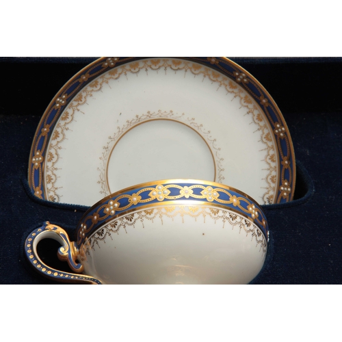 106 - A FINE 19TH CENTURY CASED LIMOGES TETE E TETE SERVICE comprising a large circular two-handled tray, ... 