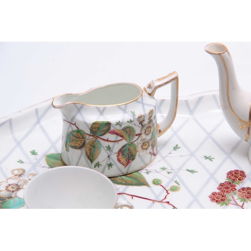 107 - A 20TH CENTURY CONTINENTAL PORCELAIN TEA FOR TWO SET comprising of a tray, two cups and saucers, sug... 