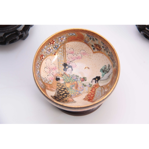 110 - A SATSUMA MINIATURE BOWL WITH FILIGREE STAND the centre with  figural and landscape panel within a g... 