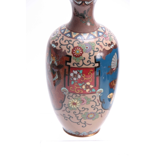 133 - A PAIR OF 20TH CENTURY CHINESE CLOISONNE VASES decorated with animals and floral work 25cm high.