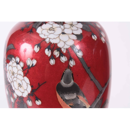 136 - A PAIR OF LATE 19TH CENTURY JAPANESE CLOISONNE VASES red ground decorated with birds on floral branc... 