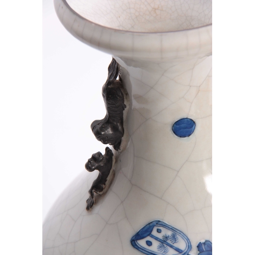 158 - A 19TH CENTURY CHINESE CRACKLE GLAZED VASE with relief decorated blue & white figures to the front a... 