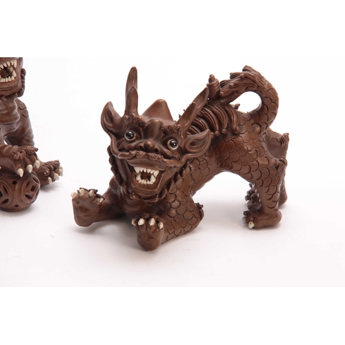 162 - A PAIR OF CHINESE TERRACOTTA DOGS OF FO with cream glazed eyes and teeth - signed with seal marks un... 