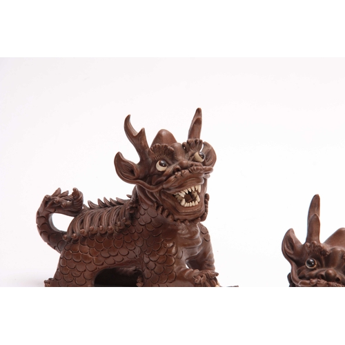 162 - A PAIR OF CHINESE TERRACOTTA DOGS OF FO with cream glazed eyes and teeth - signed with seal marks un... 