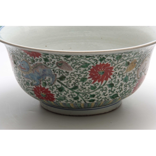 165 - A 19TH CENTURY CHINESE FAMILLE VERTE PUNCH BOWL decorated with colourful foo dogs amongst flowers 43... 