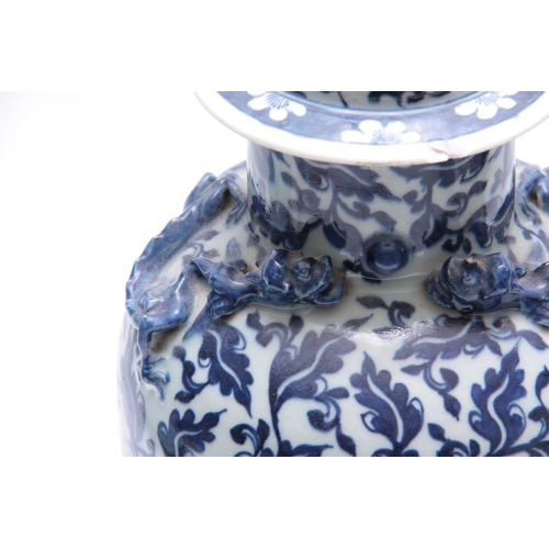 172 - A CHINESE BLUE AND WHITE PORCELAIN BULBOUS VASE AND COVER  decorated with leaf work floral decoratio... 