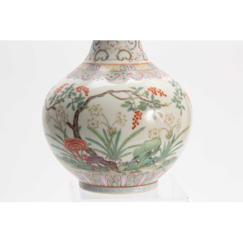 173 - A CHINESE REPUBLIC FAMILLE ROSE VASE decorated with flowers and blossoming trees with a pale blue in... 