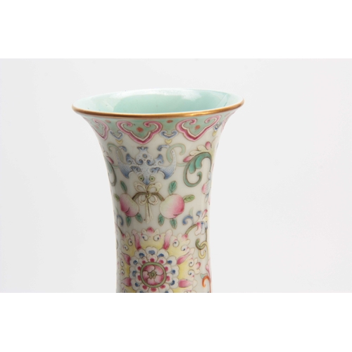 173 - A CHINESE REPUBLIC FAMILLE ROSE VASE decorated with flowers and blossoming trees with a pale blue in... 