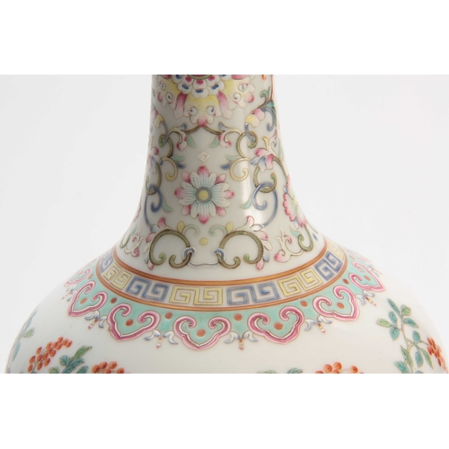 173 - A CHINESE REPUBLIC FAMILLE ROSE VASE decorated with flowers and blossoming trees with a pale blue in... 