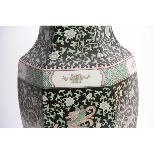 185 - A 19TH CENTURY CHINESE LARGE VASE LAMP of hexagonal tapering shouldered form with dragon work panels... 