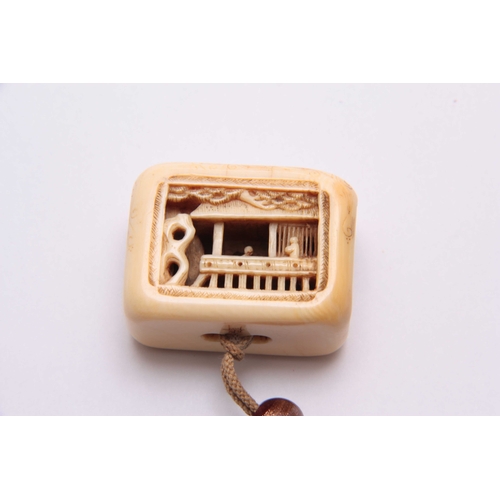 192 - A LATE 19TH CENTURY JAPANESE CARVED IVORY NETSUKE finely carved with figures in a room setting - sig... 