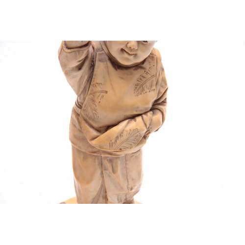 194 - A JAPANESE MEIJI PERIOD CARVED IVORY OKIMONO OF A YOUNG BOY PLAYING WITH BIRDS signed with character... 