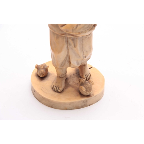 194 - A JAPANESE MEIJI PERIOD CARVED IVORY OKIMONO OF A YOUNG BOY PLAYING WITH BIRDS signed with character... 