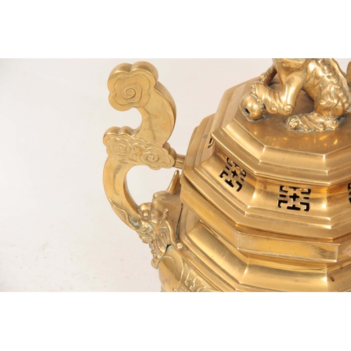 208 - A LARGE CHINESE CAST BRASS OCTAGONAL LIDDED CENSER ON STAND with Foo Dog finial and dragonhead shape... 