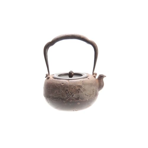 209 - A 19th CENTURY JAPANESE CAST IRON TEAPOT AND COVER of squat form with surmounted swing handle, ornam... 