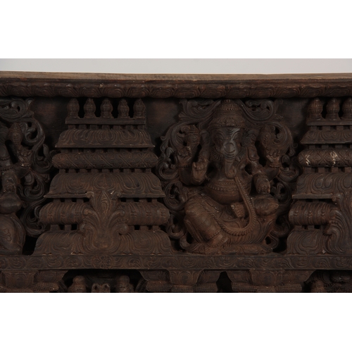 226 - A LATE 19TH CENTURY INDIAN WALL PANEL finely carved with figures amongst temples 198cm wide 100cm hi... 