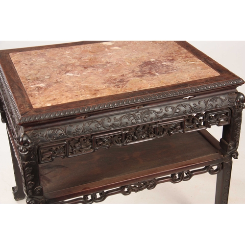 227 - A 19TH CENTURY CARVED CHINESE HARDWOOD CONSOL / ALTAR TABLE with inset marble top surrounded by a ca... 