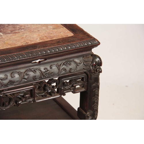 227 - A 19TH CENTURY CARVED CHINESE HARDWOOD CONSOL / ALTAR TABLE with inset marble top surrounded by a ca... 