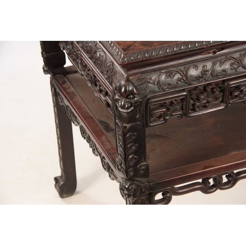 227 - A 19TH CENTURY CARVED CHINESE HARDWOOD CONSOL / ALTAR TABLE with inset marble top surrounded by a ca... 