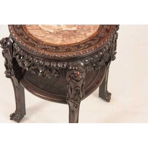 229 - A 19th CENTURY PROFUSELY CARVED CHINESE HARDWOOD CIRCULAR JARDINIERE STAND with marble inset top and... 