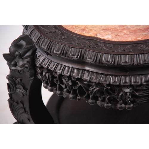 230 - A 19TH CENTURY CHINESE EBONIZED HARDWOOD VASE STAND WITH MARBLE INSET TOP leaf carved scalloped bord... 