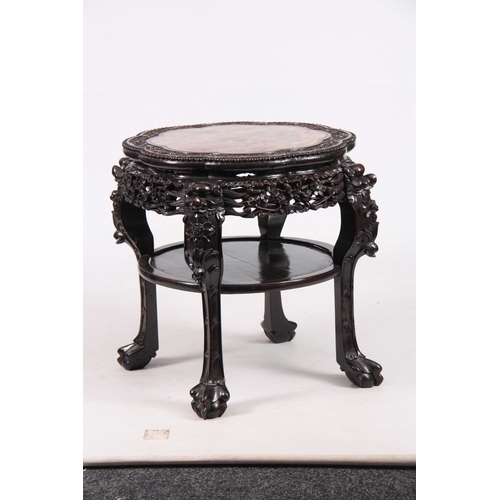 232 - A 19TH CENTURY CHINESE HARDWOOD JARDINIERE STAND with inset shaped marble top, above floral pierced ... 