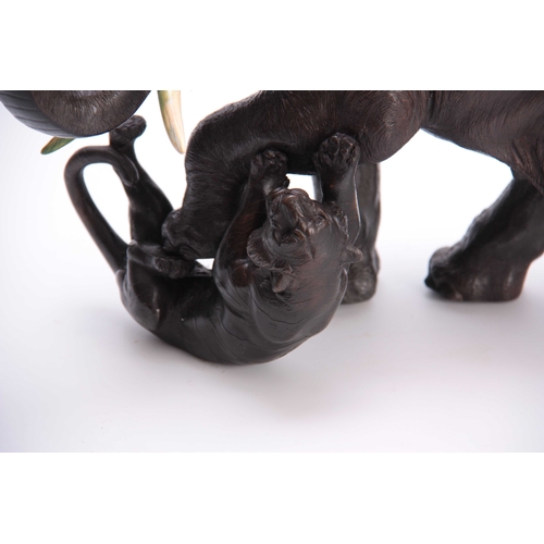 242 - A 19TH CENTURY JAPANESE BRONZE depicting an Elephant and two Tigers, fitted with ivory tusks - signe... 