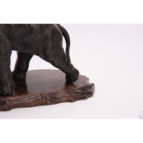 247 - A JAPANESE MEIJI PERIOD PATINATED BRONZE SCULPTURE modelled as an elephant with ivory tusks freestan... 