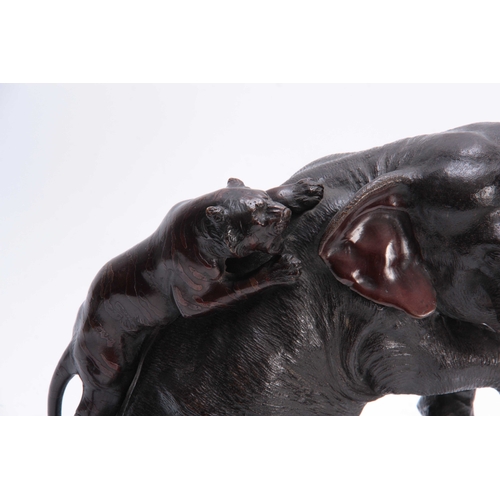 248 - A JAPANESE MEIJI PERIOD PATINATED BRONZE SCULPTURE modelled as an elephant being attacked by two tig... 