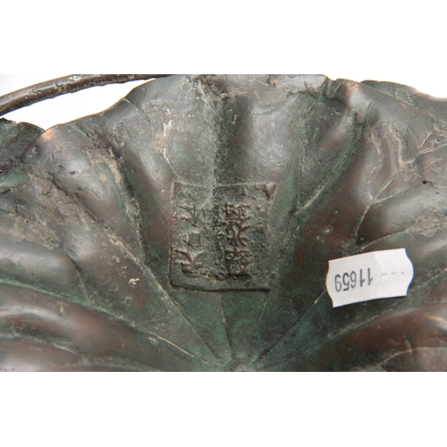 250 - A MEIJI PERIOD JAPANESE PATINATED GREEN BRONZE PEDESTAL BOWL modelled as a large lily pad with entwi... 