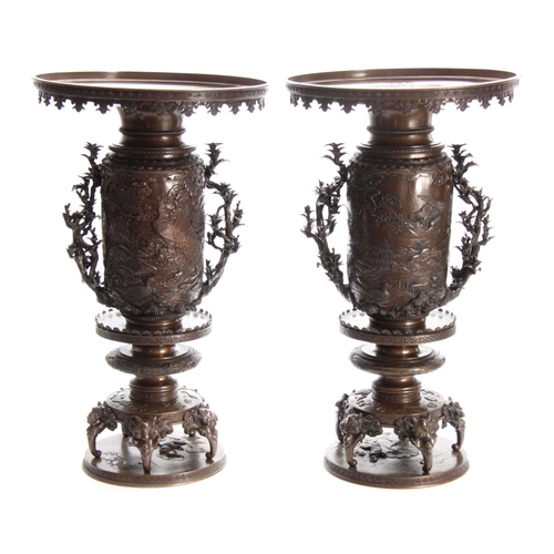 251 - A LARGE AND IMPRESSIVE PAIR OF MEIJI PERIOD JAPANESE BRONZE VASES with sconce style rims decorated w... 