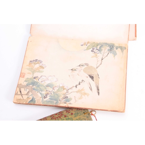 253 - A FOLDING PAPER PORTFOLIO OF SIGNED CHINESE WATERCOLOUR DRAWINGS depicting bird and floral panels to... 