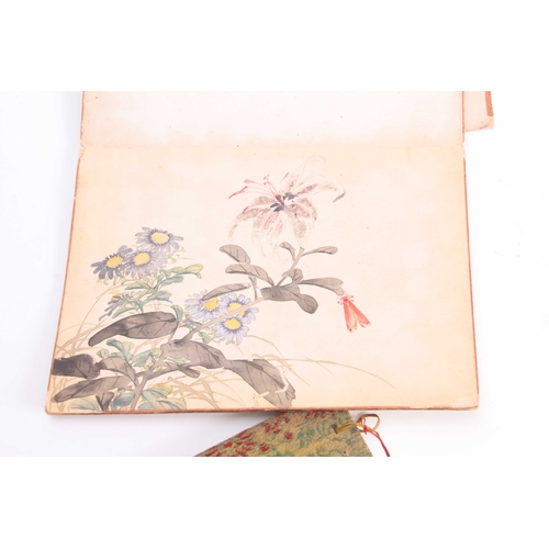 253 - A FOLDING PAPER PORTFOLIO OF SIGNED CHINESE WATERCOLOUR DRAWINGS depicting bird and floral panels to... 