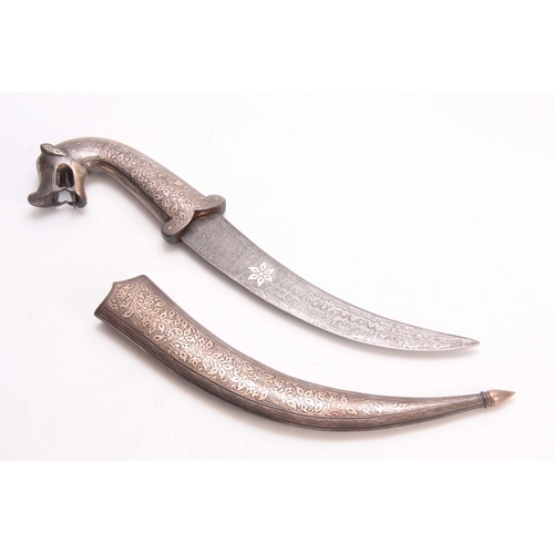 260 - A 19TH CENTURY INDIAN JAMBARI DAGGER of curved form with dogs head terminal to the handle, engraved ... 