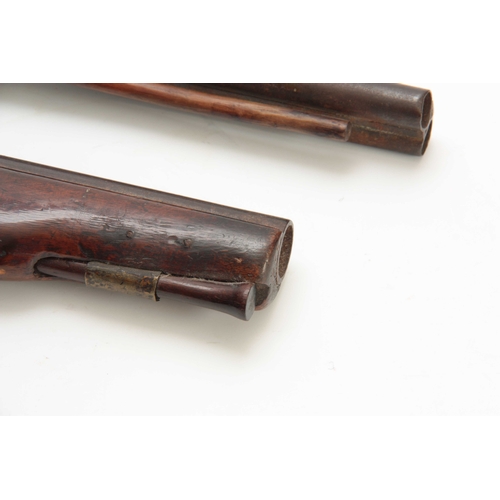 276 - A 19th CENTURY EASTERN DOUBLE BARREL PERCUSION PISTOL on a walnut stock with chequered pique work gr... 