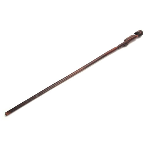 285 - AN AFRICAN CARVED HARDWOOD WALKING CANE the handle modeled as a standing figure 91cm overall