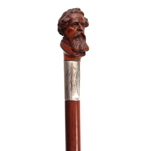 294 - AN EARLY 20th CENTURY CARVED CHARLES DICKENS WALKING CANE the realistically carved handle on a large... 