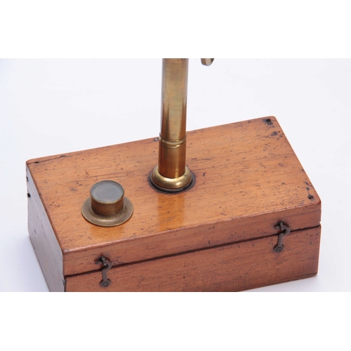 316 - A LATE 19th CENTURY PORTABLE MICROSCOPE having a hinged mahogany box with brass threaded fitting ope... 