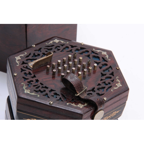 320 - A LATE 19th CENTURY CONCERTINA POSSIBLY BY WHEATSTONE having pierced rosewood ends inlaid with nicke... 