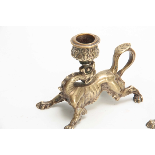 334 - A PAIR OF 19TH CENTURY CONTINENTAL NICKEL PLATED STYLISED GRIFFIN CANDLESTICKS with raised flower he... 