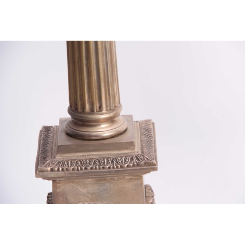 339 - A PAIR OF 20TH CENTURY CORINTHIAN COLUMN SILVERED BRASS LAMPS with reeded tapering stems and plinth ... 