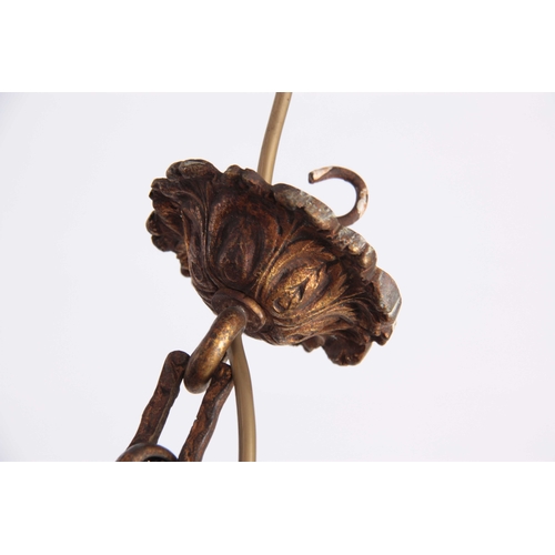 351 - AN EARLY 20TH CENTURY GILT CAST BRASS HANGING HALL LANTERN of inverted acorn shape with cut and fros... 