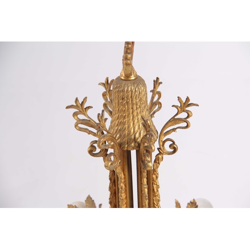 354 - AN EARLY 20TH CENTURY BRASS ORMOLU CHANDELIER / CEILING LIGHT having six leaf cast light fittings wi... 