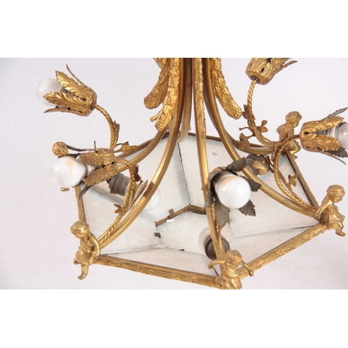 354 - AN EARLY 20TH CENTURY BRASS ORMOLU CHANDELIER / CEILING LIGHT having six leaf cast light fittings wi... 