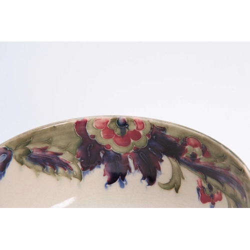 38 - A WILLIAM MOORCROFT BURSLEM FOOTED TWO-HANDLED BOWL with colourful tube lined flowerhead and leaf sp... 