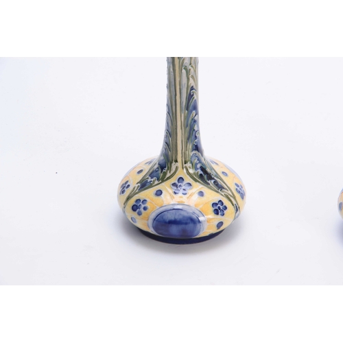 41 - AN UNUSUAL PAIR OF JAMES MACINTYRE PEACOCK DESIGN FLORIANWARE SQUAT BULBOUS SLENDER TAPERING VASES W... 