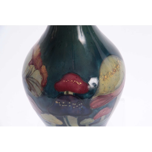 52 - A MOORCROFT CLAREMONT BALUSTER VASE the body decorated with a continuous band of unusual toadstools ... 