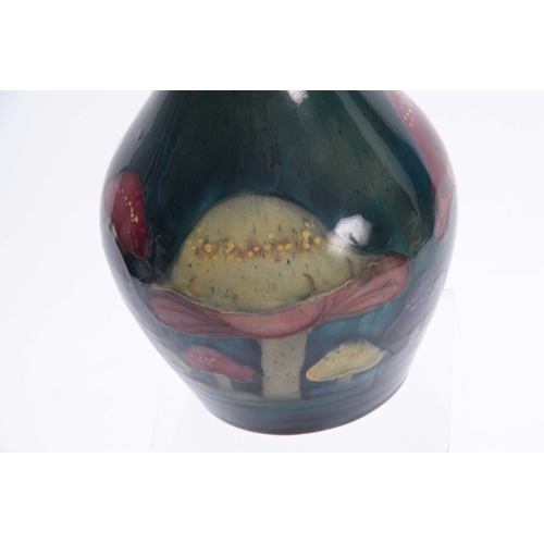 52 - A MOORCROFT CLAREMONT BALUSTER VASE the body decorated with a continuous band of unusual toadstools ... 