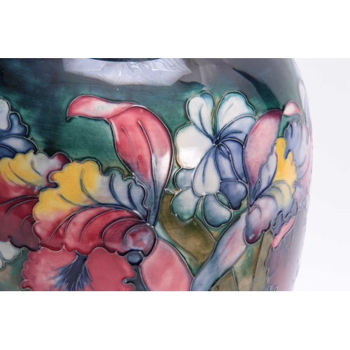 61 - A LARGE 20TH CENTURY MOORCROFT BULBOUS VASE decorated with Orchids - signed underneath W. Moorcroft ... 