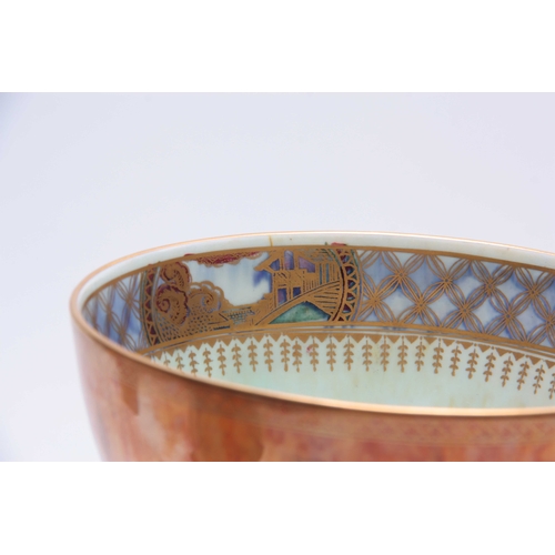 67 - AN EARLY 20th CENTURY WEDGEWOOD LUSTER BOWL decorated with butterflies on a mottled orange exterior ... 